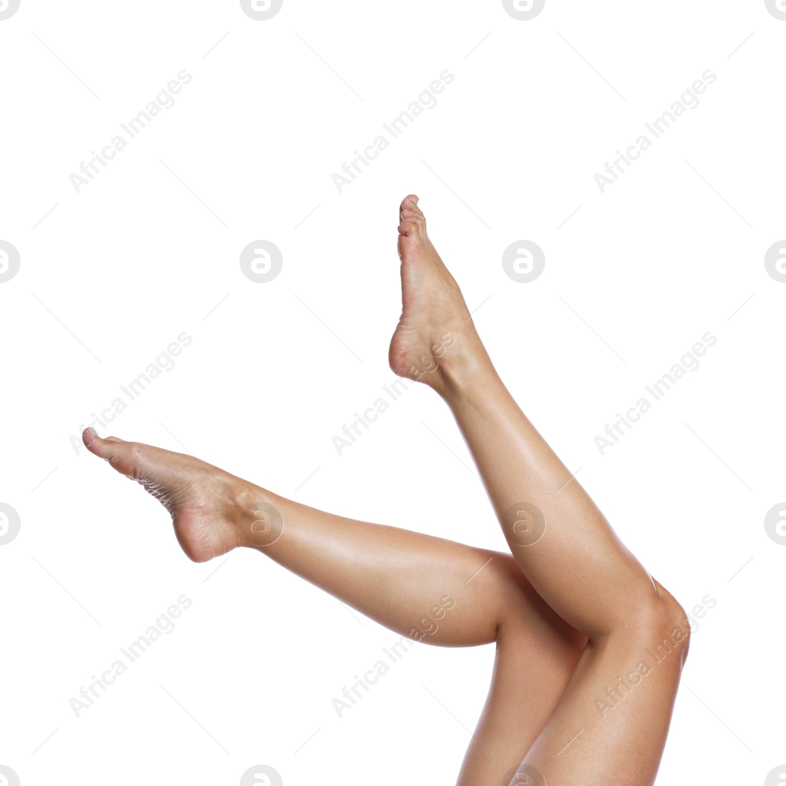 Woman with beautiful smooth legs after epilation on white background, closeup Photo of Woman with beautiful smooth legs after epilation on white background, closeup