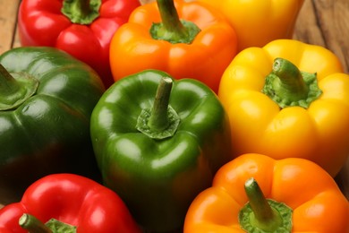 Photo of Fresh colorful bell peppers on table, closeup