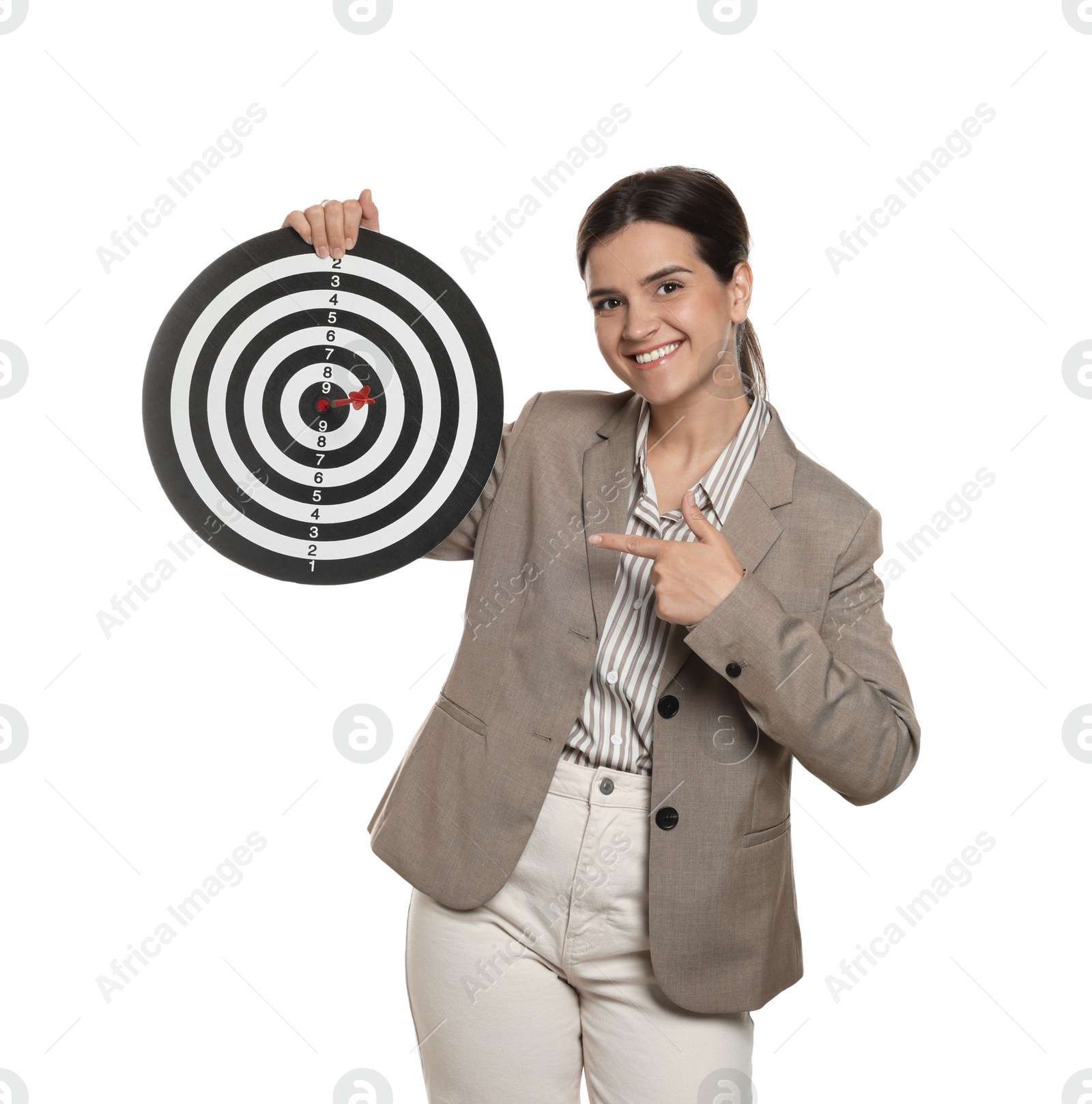 Targeting. Smiling businesswoman pointing at dart board on white background Photo of Targeting. Smiling businesswoman pointing at dart board on white background