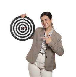 Photo of Targeting. Smiling businesswoman pointing at dart board on white background