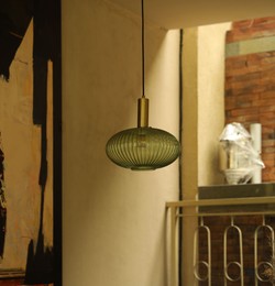 Photo of Stylish pendant lamp hanging indoors. Interior design