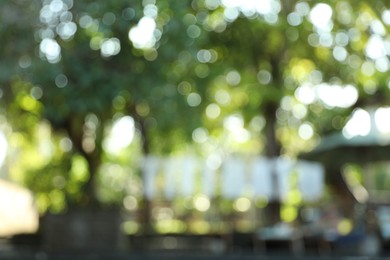 Photo of Blurred view of different green trees outdoors