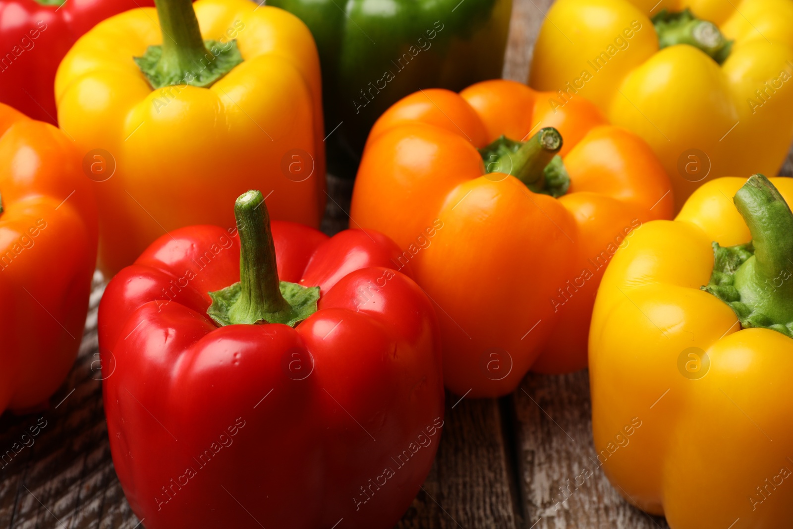 Fresh colorful bell peppers on table, closeup Photo of Fresh colorful bell peppers on table, closeup