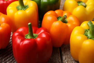 Photo of Fresh colorful bell peppers on table, closeup