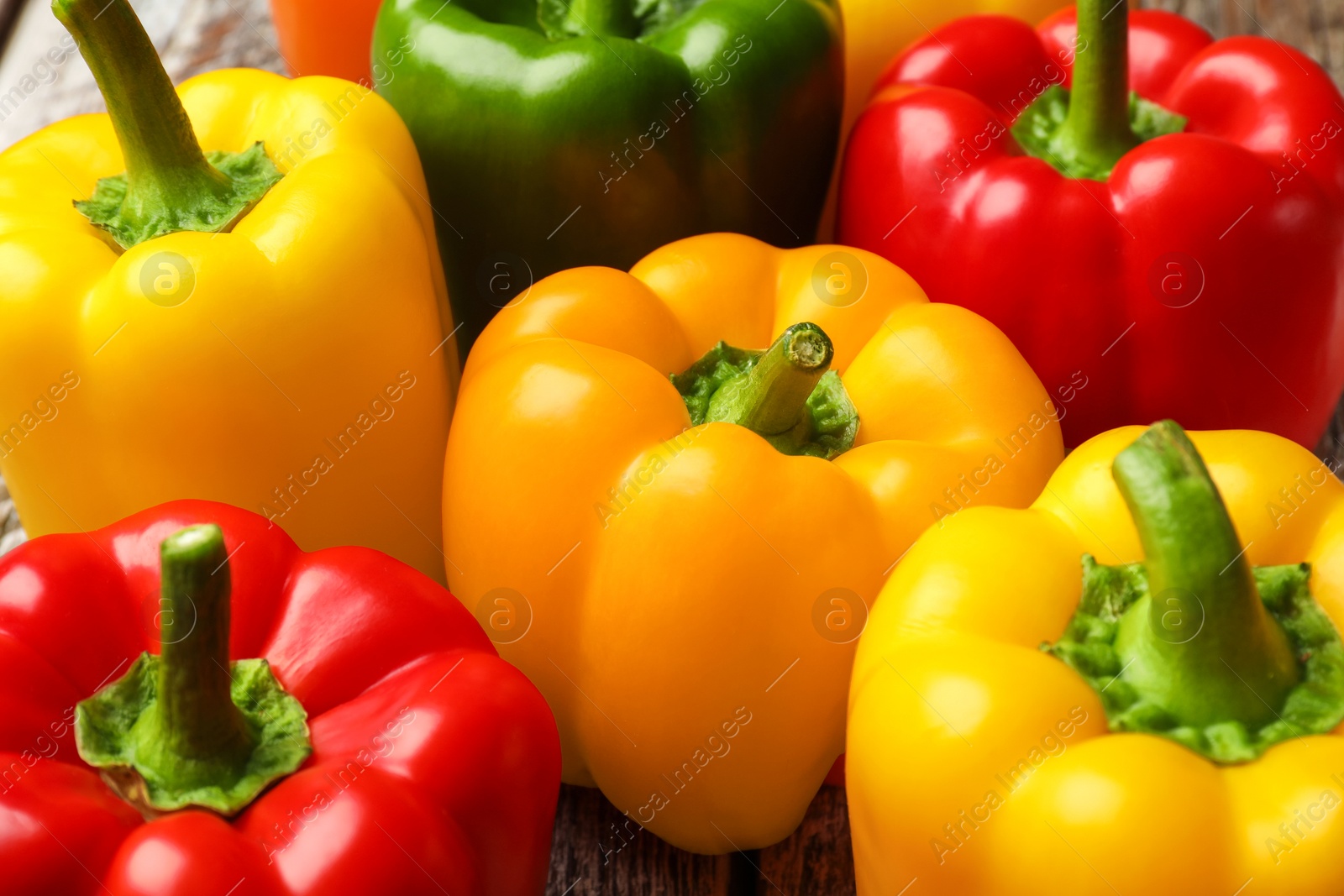 Fresh colorful bell peppers on table, closeup Photo of Fresh colorful bell peppers on table, closeup