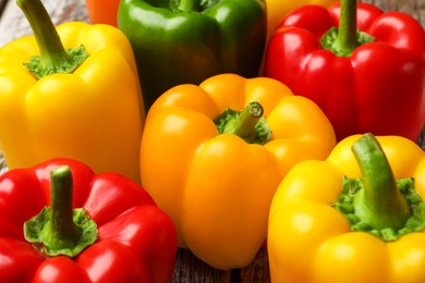 Photo of Fresh colorful bell peppers on table, closeup