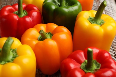 Photo of Fresh colorful bell peppers on table, closeup