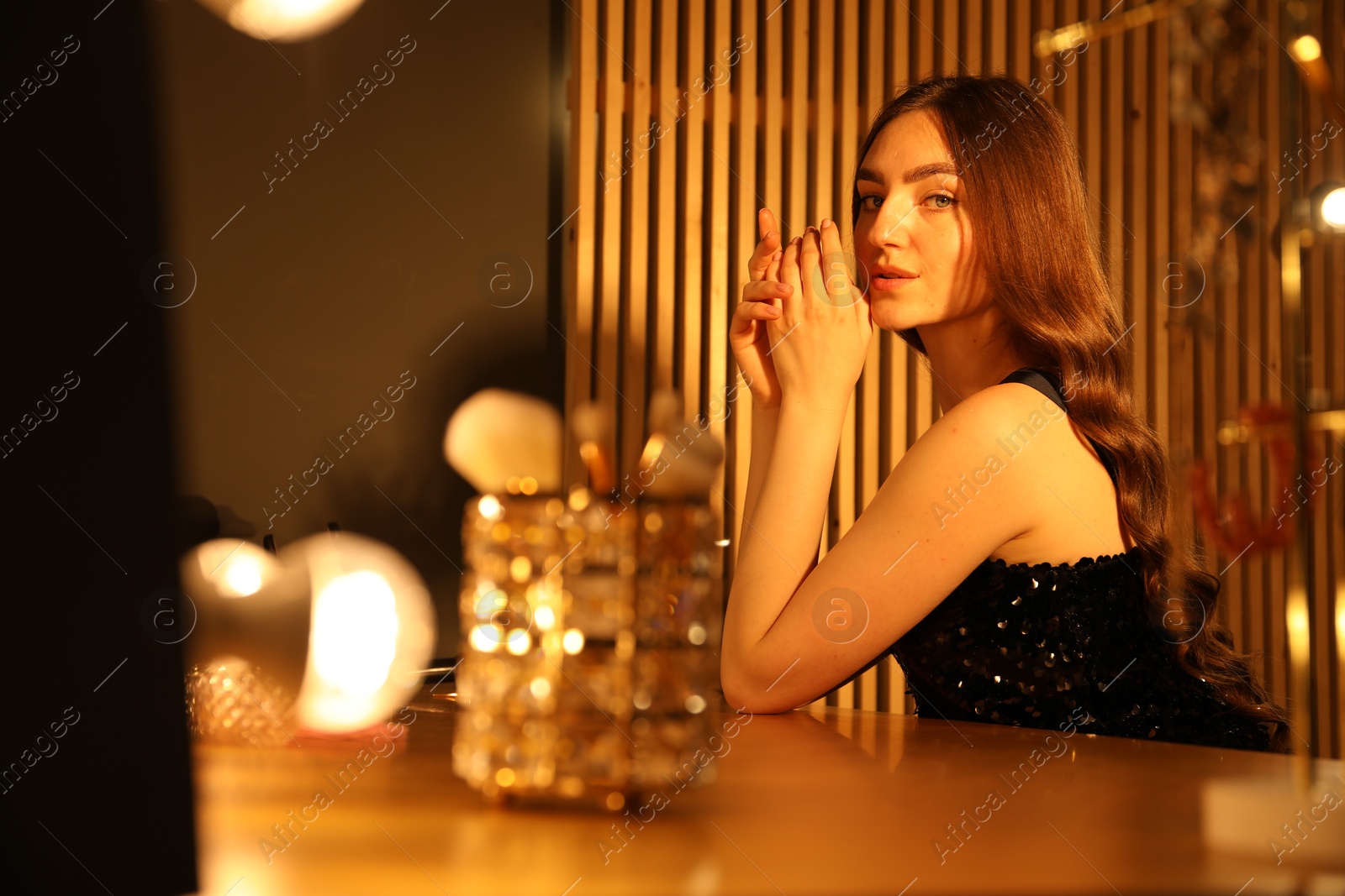 Woman with beautiful long hair in dressing room Photo of Woman with beautiful long hair in dressing room