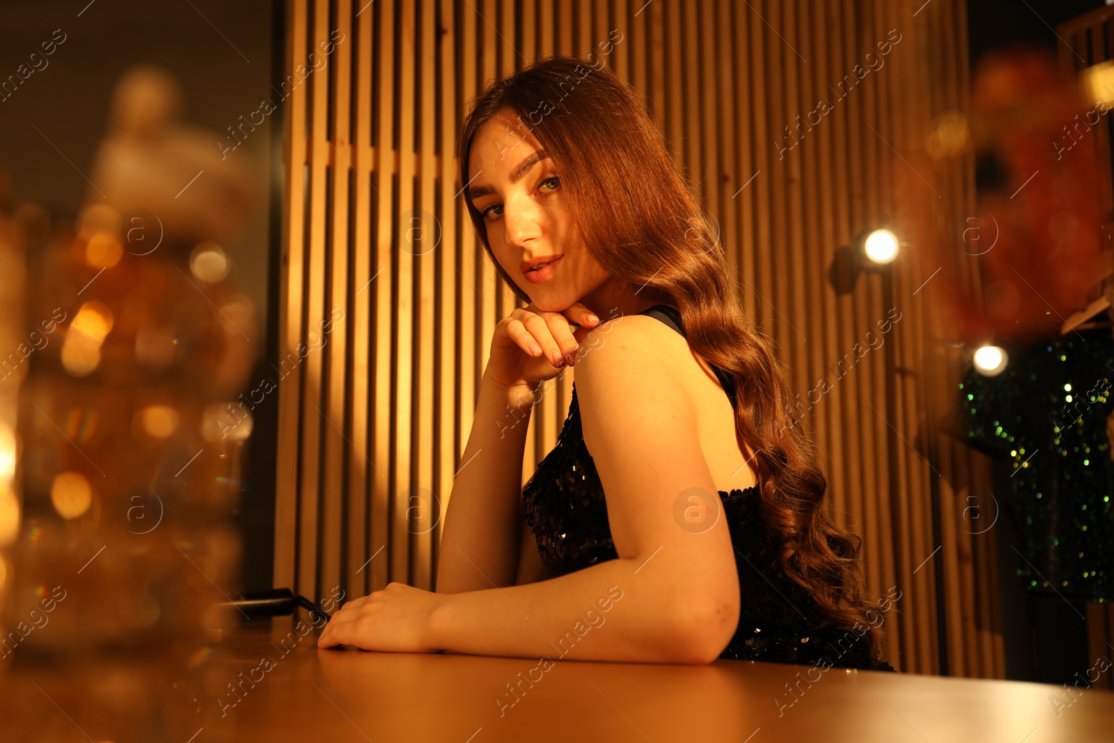 Woman with beautiful long hair in dressing room Photo of Woman with beautiful long hair in dressing room