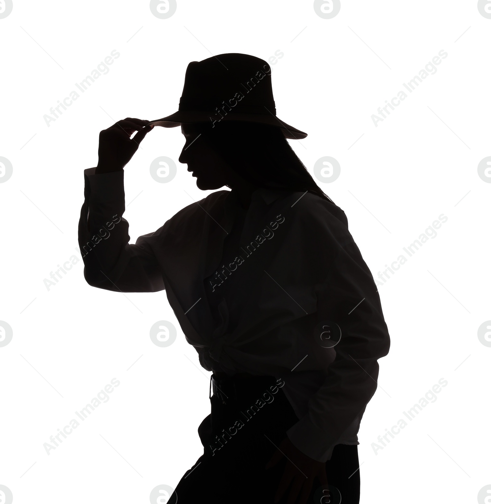 Silhouette of woman in hat on white background Photo of Silhouette of woman in hat on white background
