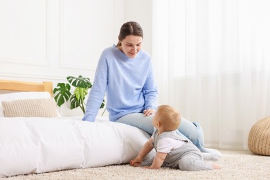 Photo of Mother and her little baby at home