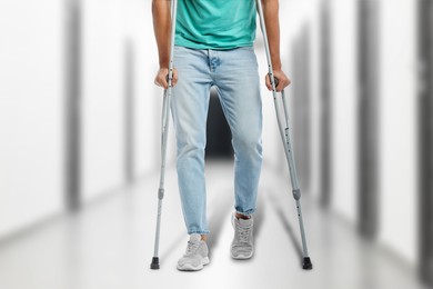 Image of Man with axillary crutches in hospital, closeup