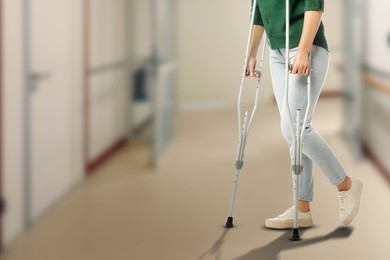 Image of Woman with axillary crutches in hospital, closeup. Space for text