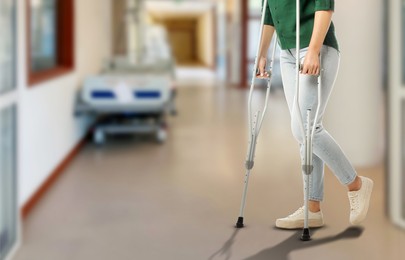 Image of Woman with axillary crutches in hospital, closeup. Banner design