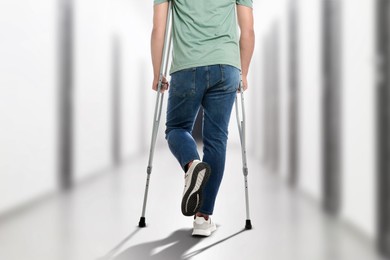 Image of Man with axillary crutches in hospital, closeup