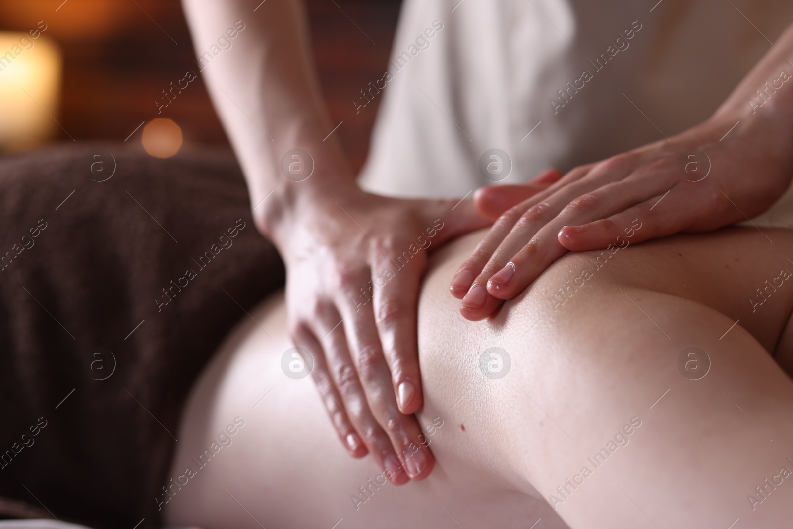 Woman receiving back massage with oil in spa salon, closeup Photo of Woman receiving back massage with oil in spa salon, closeup