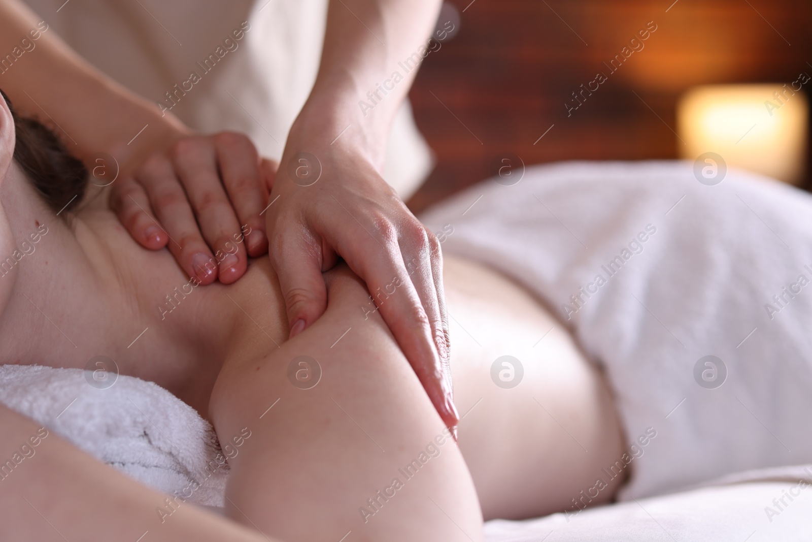 Woman receiving back massage with oil in spa salon, closeup Photo of Woman receiving back massage with oil in spa salon, closeup