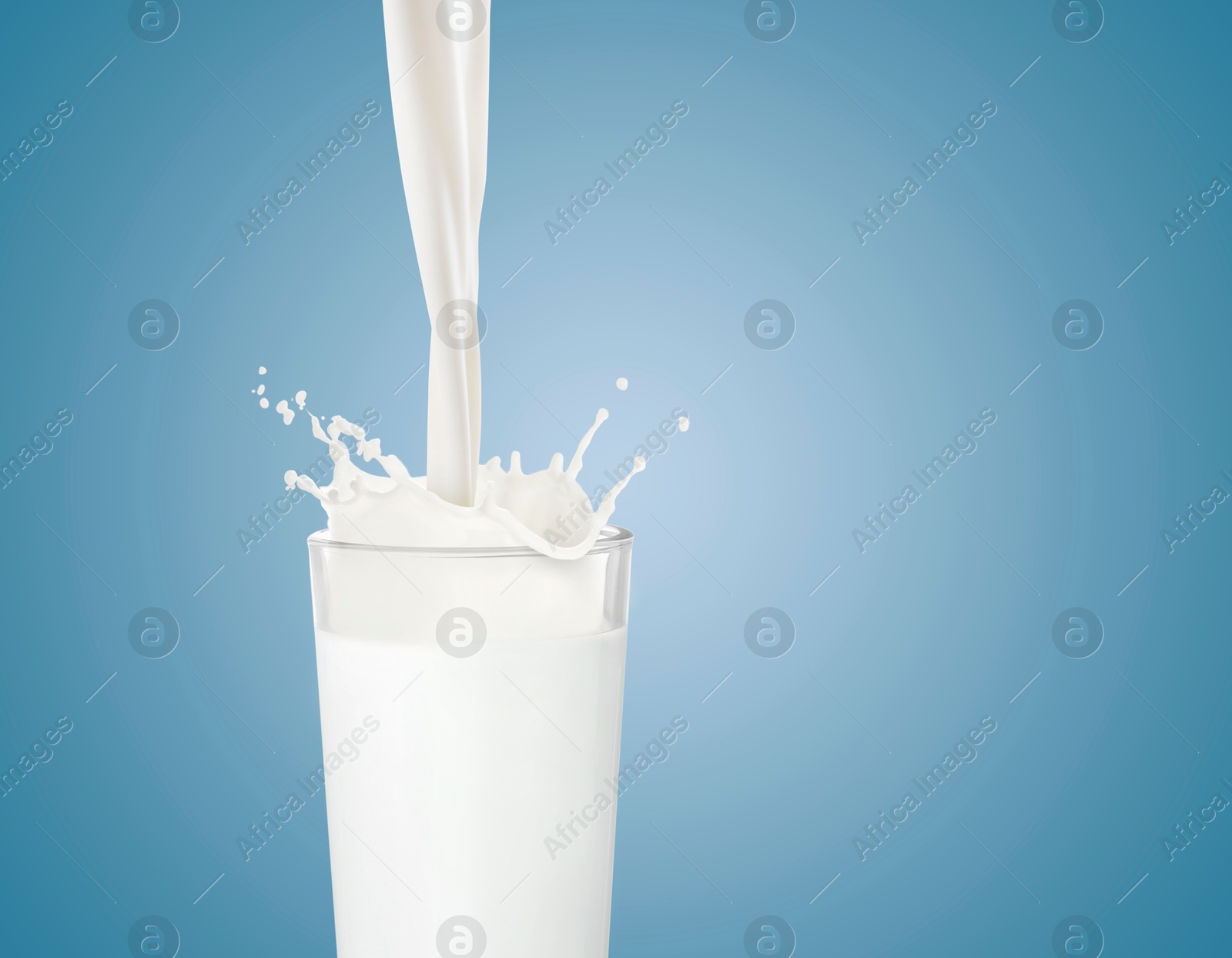 Pouring fresh milk into glass against light blue background. Liquid splashing out of glass Image of Pouring fresh milk into glass against light blue background. Liquid splashing out of glass