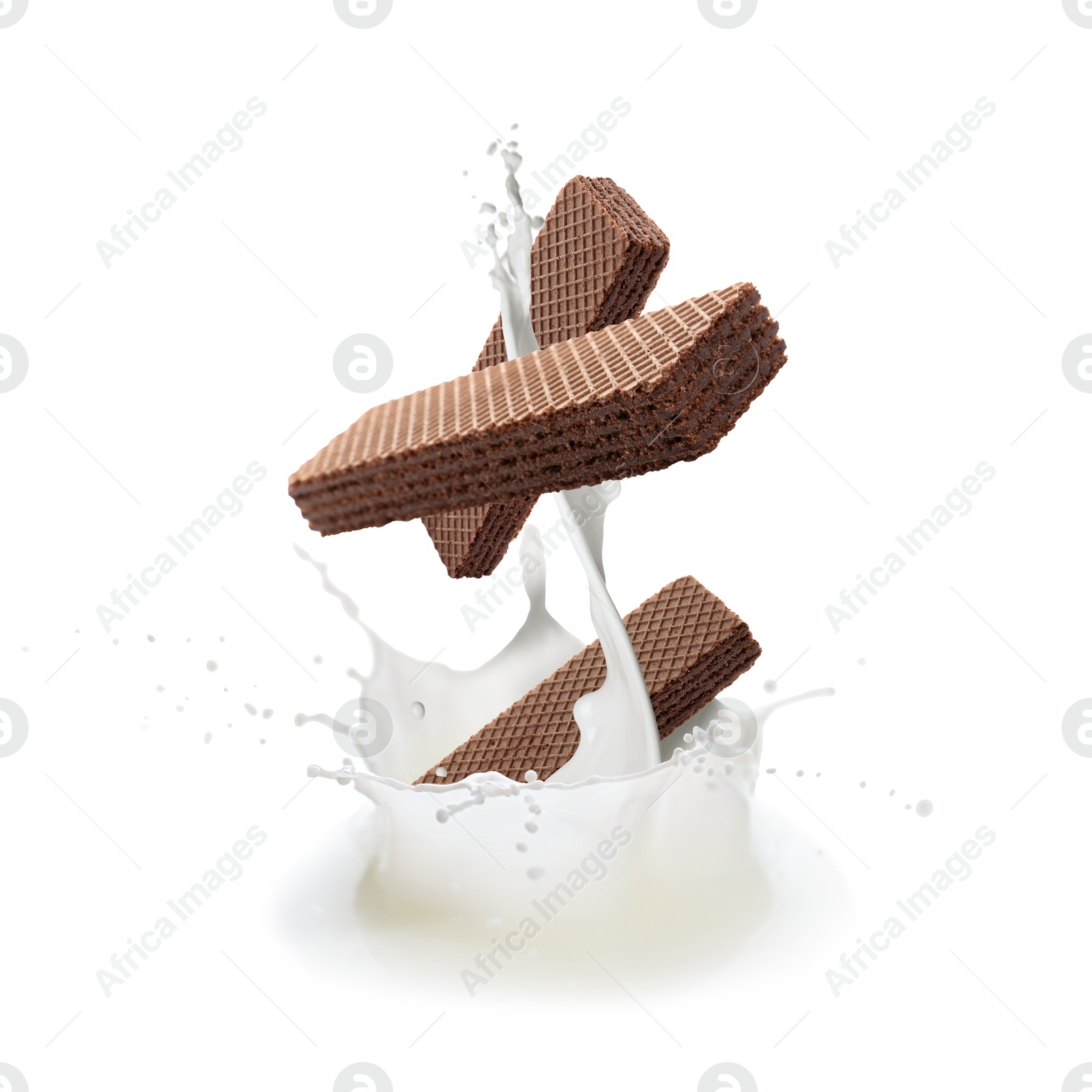 Tasty crispy wafers falling into splashing milk against white background Image of Tasty crispy wafers falling into splashing milk against white background