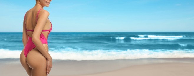 Image of Attractive woman in swimsuit on beautiful beach, closeup. Banner design