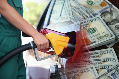 Image of Fuel price. Gas station attendant refueling car, double exposure with dollar banknotes