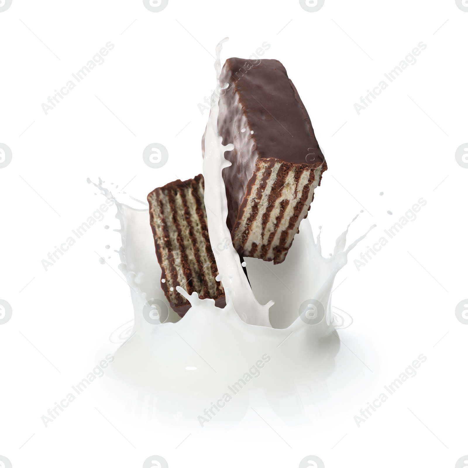 Tasty crispy wafer falling into splashing milk against white background Image of Tasty crispy wafer falling into splashing milk against white background