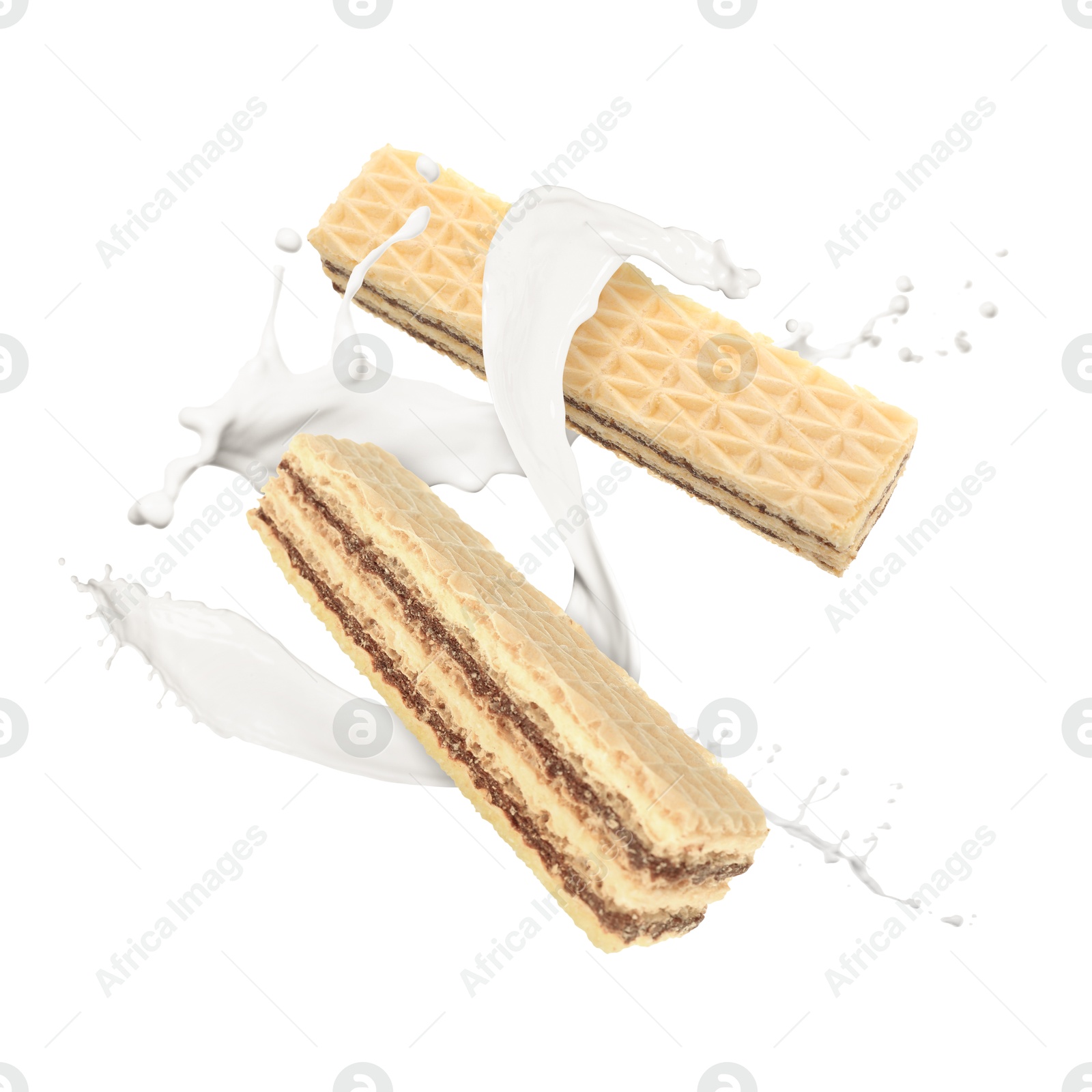 Tasty crispy wafers and splashing milk on white background Image of Tasty crispy wafers and splashing milk on white background