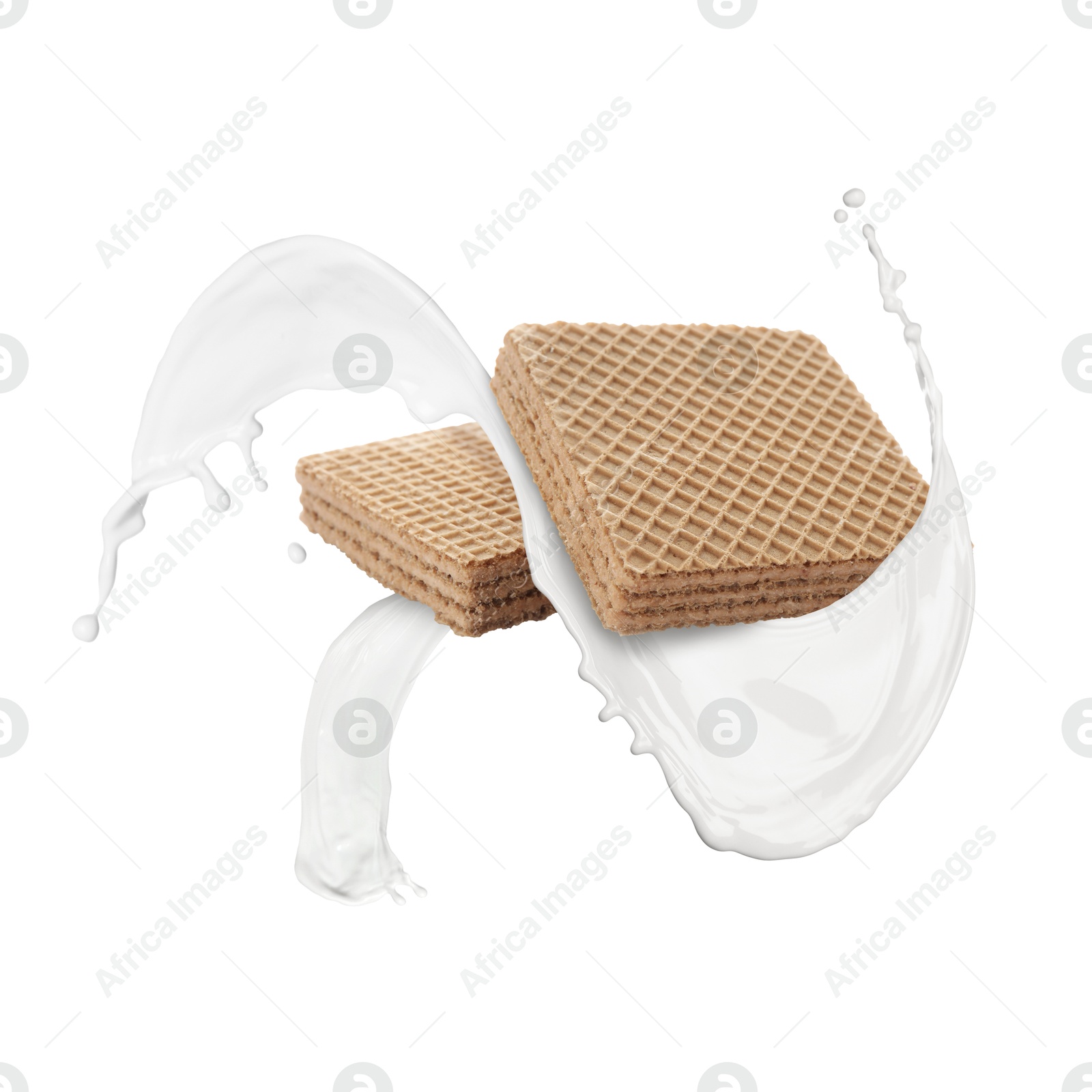 Tasty crispy wafers and splashing milk on white background Image of Tasty crispy wafers and splashing milk on white background