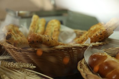 Photo of Wicker basket with tasty food in school canteen, closeup