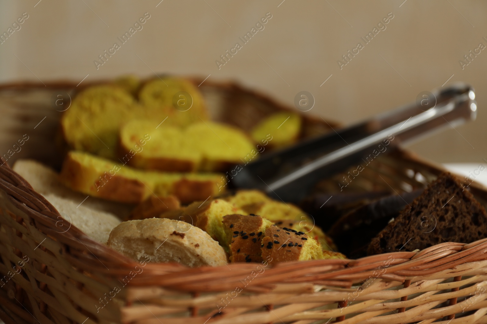 Photo of Wicker basket with tasty food in school canteen, closeup
