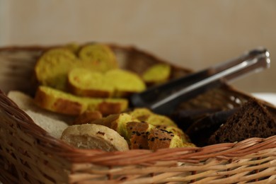 Photo of Wicker basket with tasty food in school canteen, closeup
