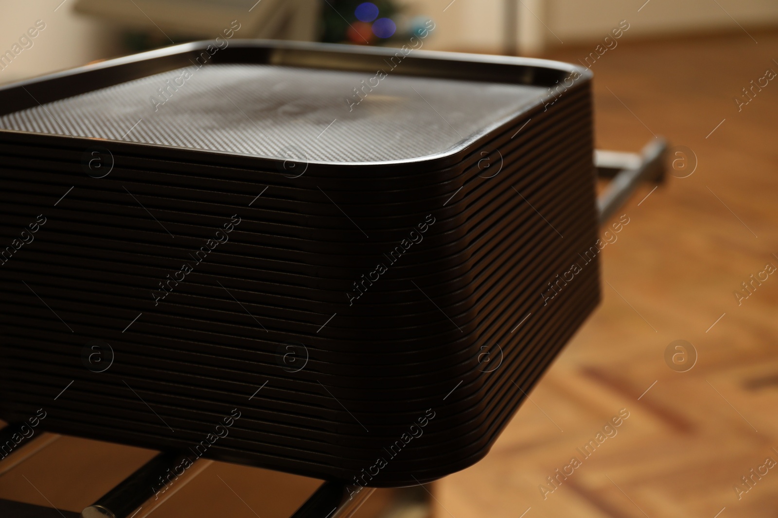 Stack of plastic trays for food in school canteen Photo of Stack of plastic trays for food in school canteen