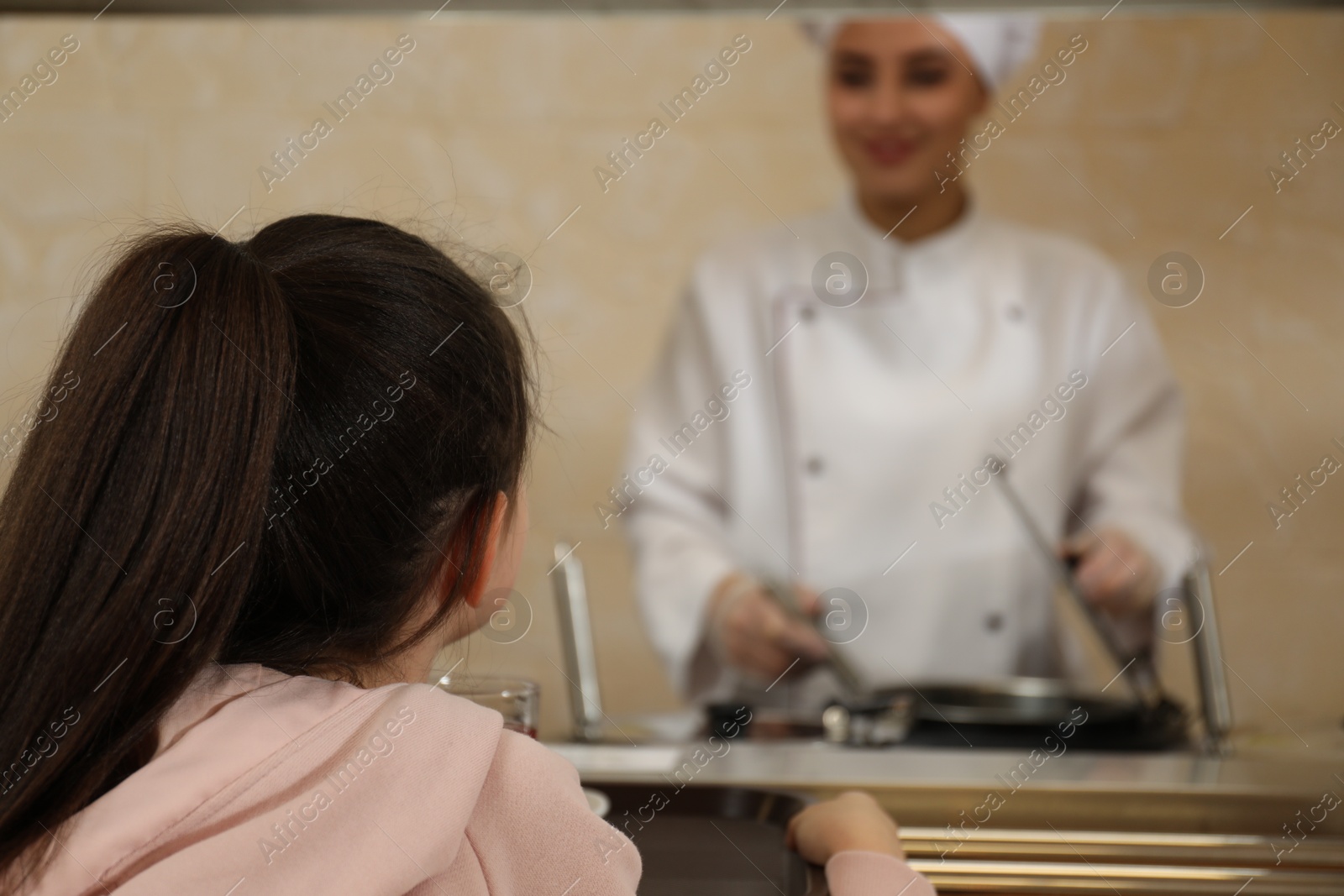 Little girl with plastic tray near serving line in canteen. School food Photo of Little girl with plastic tray near serving line in canteen. School food