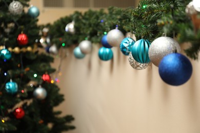 Photo of Stylish decorations near Christmas tree indoors. Holiday season