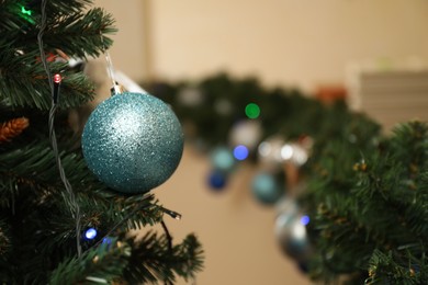 Photo of Decorated Christmas tree indoors, closeup. Space for text