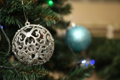 Photo of Decorated Christmas tree indoors, closeup. Space for text