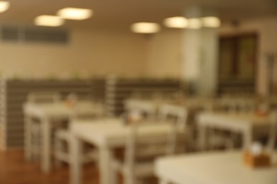 Photo of Blurred view of modern school canteen with new furniture
