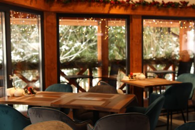 Photo of Modern cafe interior with new stylish furniture
