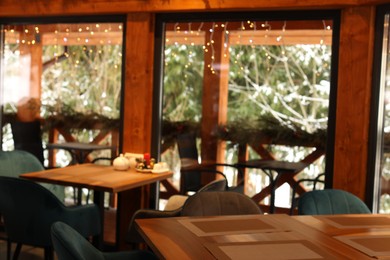 Photo of Modern cafe interior with new stylish furniture