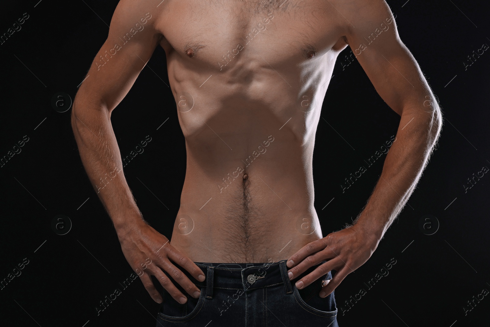 Man suffering from anorexia on black background, closeup Photo of Man suffering from anorexia on black background, closeup