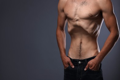 Photo of Man suffering from anorexia on grey background, closeup. Space for text