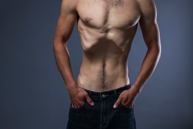 Photo of Man suffering from anorexia on grey background, closeup