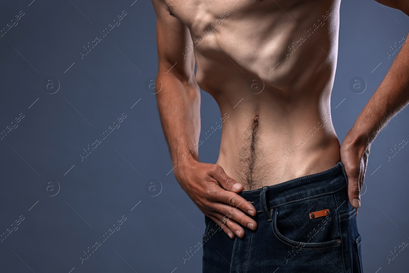 Man suffering from anorexia on grey background, closeup. Space for text Photo of Man suffering from anorexia on grey background, closeup. Space for text