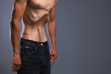 Photo of Man suffering from anorexia on grey background, closeup. Space for text
