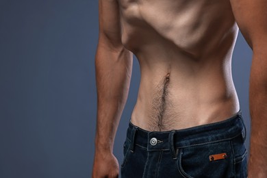 Photo of Man suffering from anorexia on grey background, closeup. Space for text