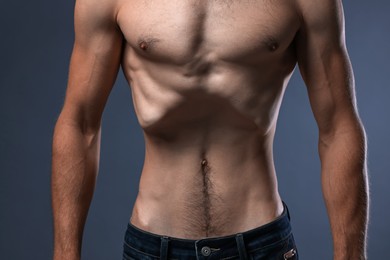 Photo of Man suffering from anorexia on grey background, closeup