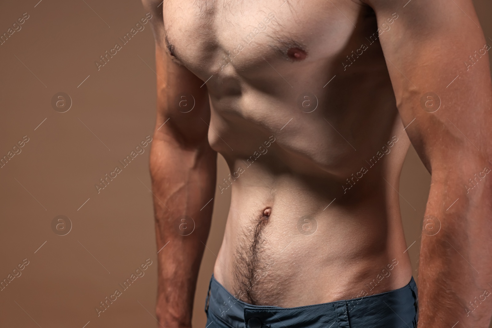 Man suffering from anorexia on beige background, closeup Photo of Man suffering from anorexia on beige background, closeup