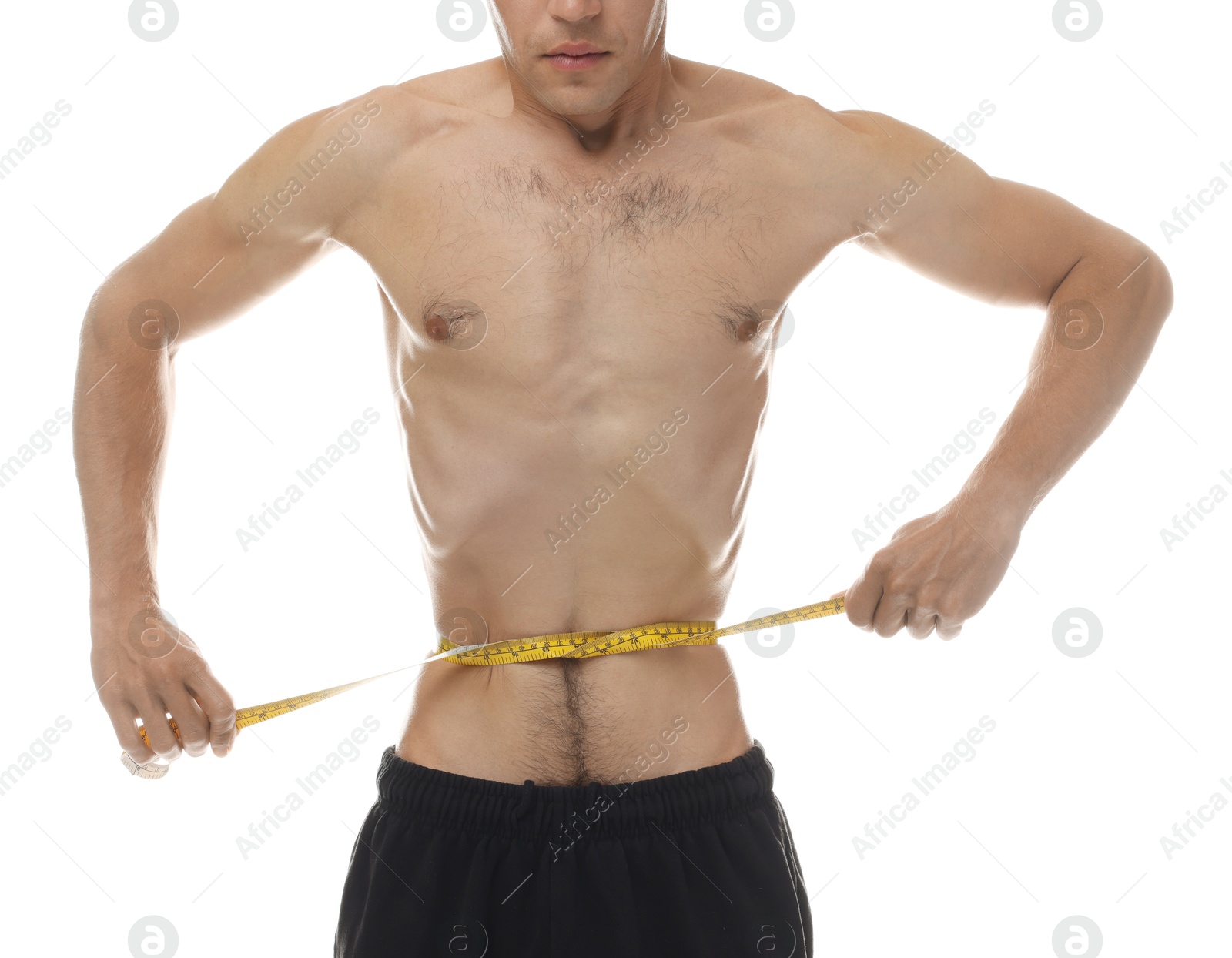 Anorexic man measuring his waist on white background, closeup Photo of Anorexic man measuring his waist on white background, closeup