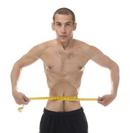 Photo of Anorexic man measuring his waist on white background