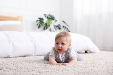 Photo of Cute little baby girl crying at home